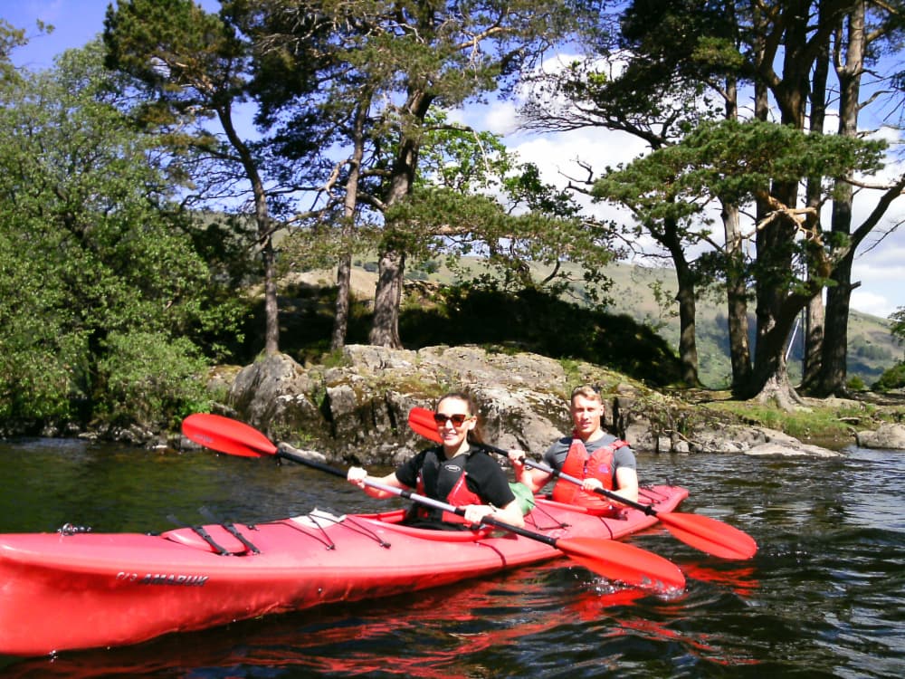 a group of people riding on the back of a boat