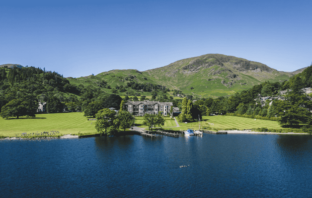 Beautiful lakeside view of the Inn on the Lake, a luxury hotel in the Lake District, offering serene Ullswater views, ideal for relaxation, weddings, and outdoor activities